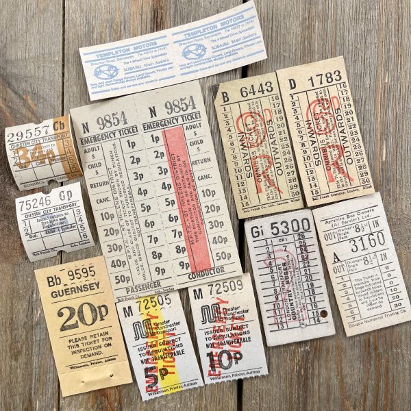 Twelve different vintage neutral-tone British bus tickets.