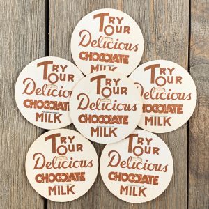 White milk caps that have brown text that says “Try Our Delicious Chocolate Milk”