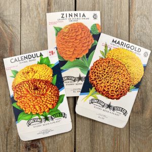 Three flower seed packets each featuring a different orange flower illustration.