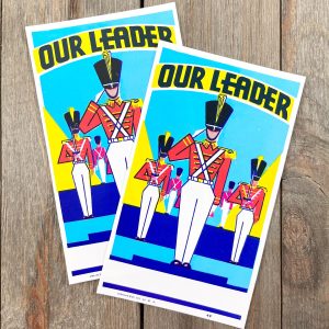 2 Vintage Our Leader broom labels featuring toy soldiers.