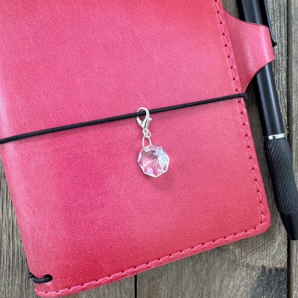 1 Handmade chandelier crystal journal charm on a pink leather travelers notebook.