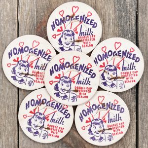 6 Vintage cardboard milk caps featuring a cartoon girl and hearts.