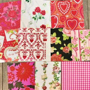 10 Different vintage pieces of Valentine’s Day gift wrap, featuring roses, hearts, etc.