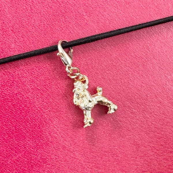 1 Handmade vintage gold-tone poodle charm with lobster clasp on a pink leather journal.