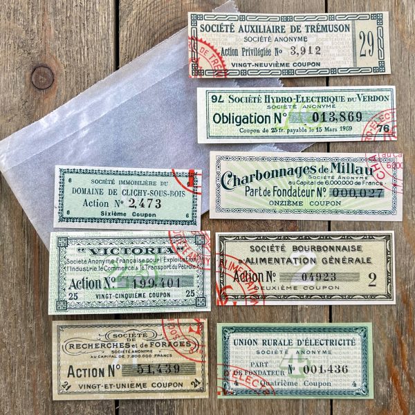 8 Different vintage French bond certificate coupons in shades of green