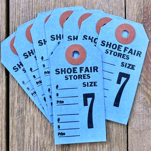Eight vintage blue shoe tags