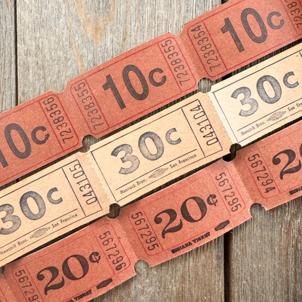 Three rows of brown & beige vintage carnival tickets