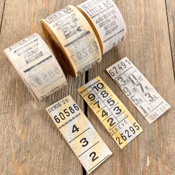 Three rolls of yellow & white vintage Argentina bus tickets