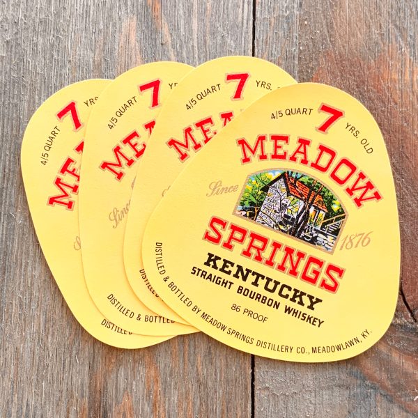 4 Vintage rounded triangle shaped labels for Meadow Springs Bourbon Whiskey, featuring an illustration of a cabin in the woods