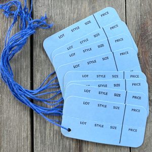 Eight vintage strung sky blue horizontal clothing tags with dark blue strings