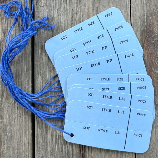 Eight vintage strung sky blue horizontal clothing tags with dark blue strings