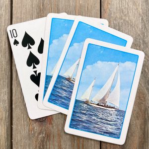 Four vintage playing cards featuring 2 sailboats on the ocean