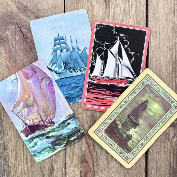 Four different vintage ship playing cards