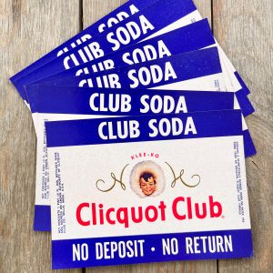 Six vintage mid-century Clicquot Club Club Soda labels featuring a cute Eskimo child