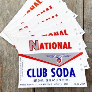 Six vintage red, white, and blue National Club Soda labels