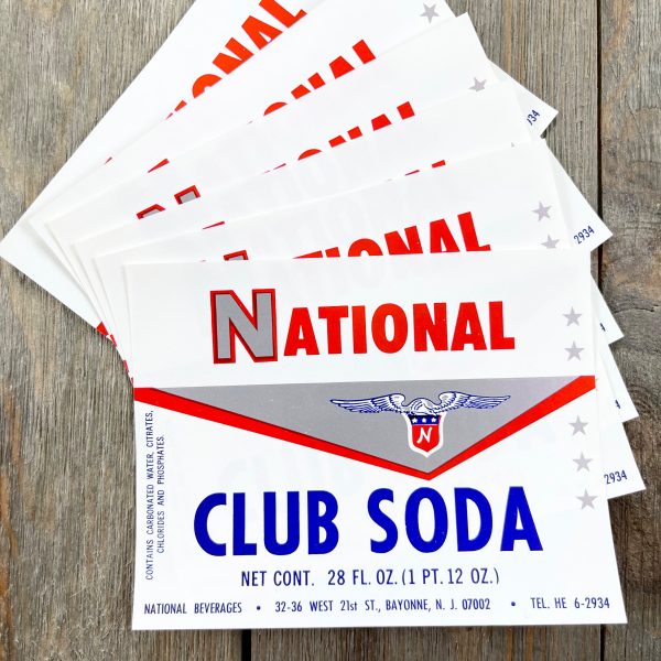 Six vintage red, white, and blue National Club Soda labels