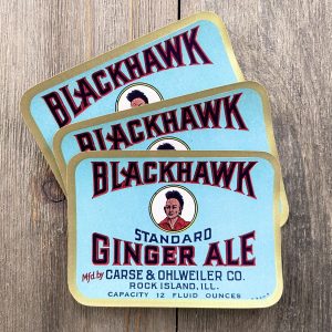 Three vintage blue Blackhawk Ginger Ale soda labels featuring an illustration of a Native American