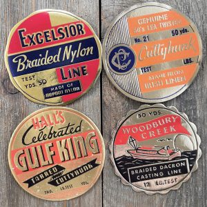 Four different vintage warm-tone gold foil fishing line labels from the 1930s