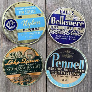 Four different vintage cool-tone gold foil fishing line labels from the 1930s
