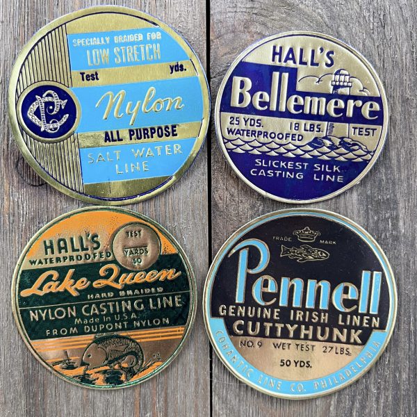 Four different vintage cool-tone gold foil fishing line labels from the 1930s
