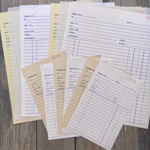 Five vintage sales order receipts with five matching duplicates