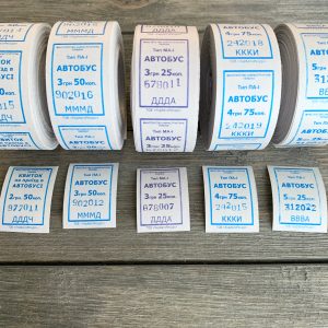 Five rolls of vintage blue and white Ukrainian bus tickets