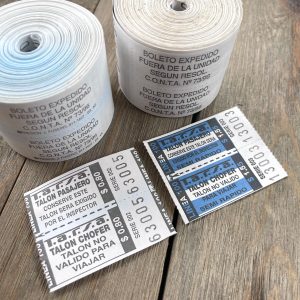 Two rolls of vintage blue and white two-part bus tickets from Argentina