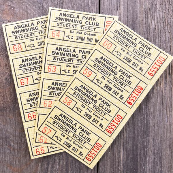 Three strips of four yellow Angela Park Swimming Club coupon book tickets