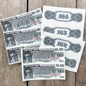 Ten antique grey railroad bond coupons