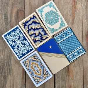 Six different vintage blue patterned playing cards