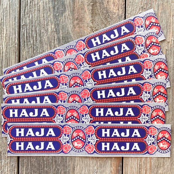 Six red, white and blue vintage Haja cigar box label strips with rose illustrations