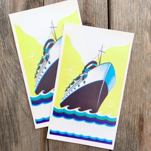 Two vintage stock broom labels featuring a ship illustration