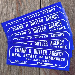 Six vintage bright blue Real Estate advertising labels with white text